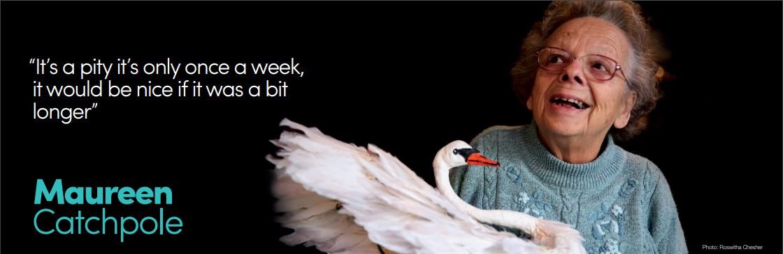 woman with hand made swan sculpture