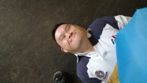man laying on floor smiling