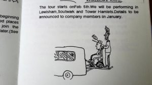 drawing of a person loading a man with a feather hat in a wheelchair into a van.