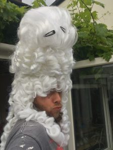 man wearing very high white wig