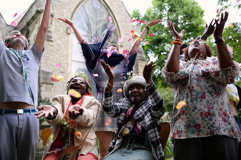 people jumping for joy outdoors