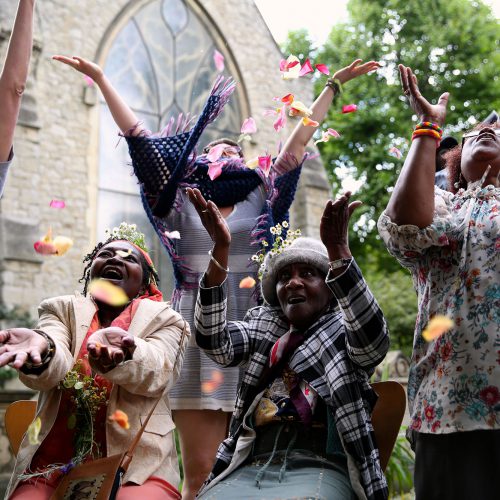 people jumping for joy outdoors