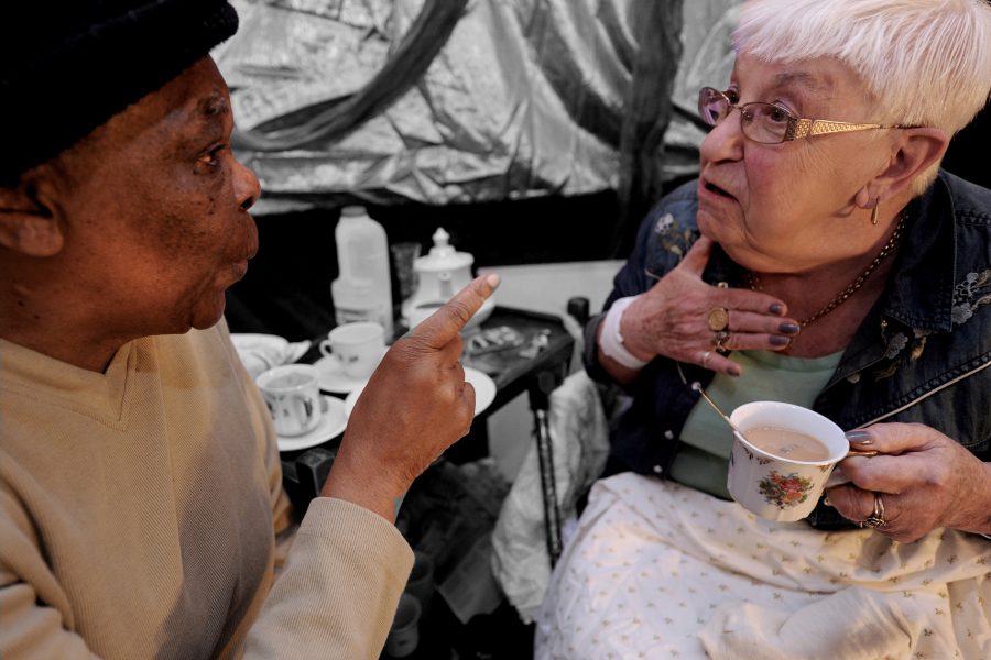 two older women talking over tea