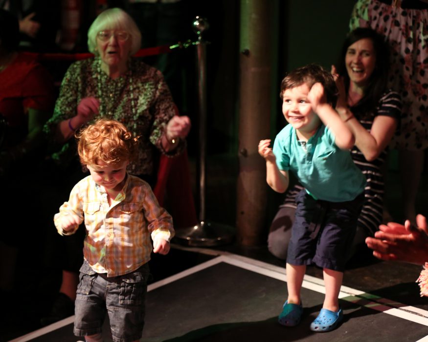 Children and older people dancing