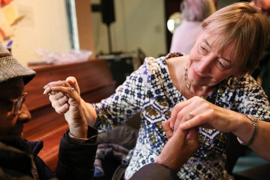 Two women holding hands