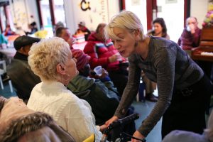 A Volunteer talking to a participant