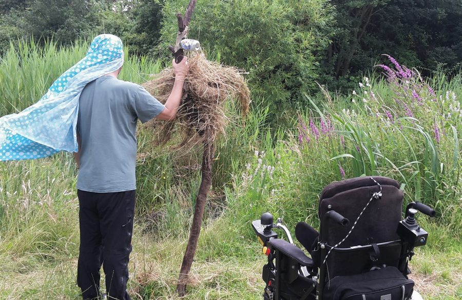 outdoors in green space participant with a natural sculpture