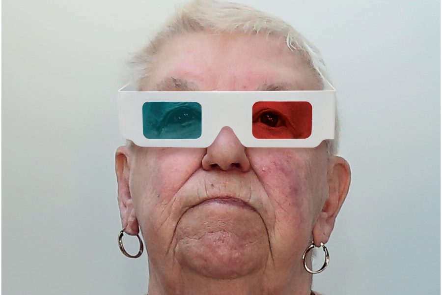 older woman with 3D folm glasses on