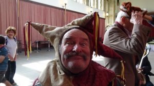 Man in funny hat grinning