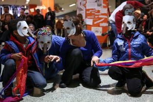 group of young children in masks