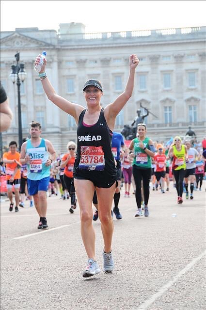 woman completing marathon