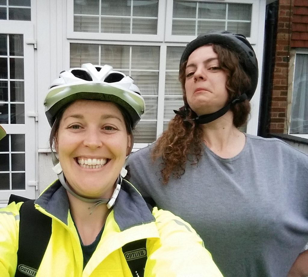 two women in cycling helmets