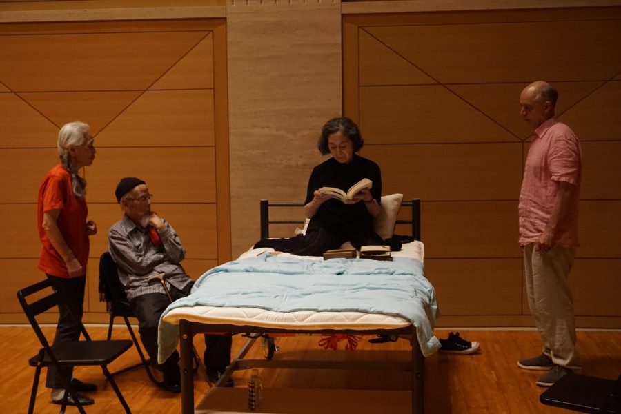 actor in a bed with director standing