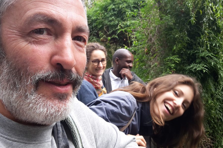 group of people looking at camera in woods