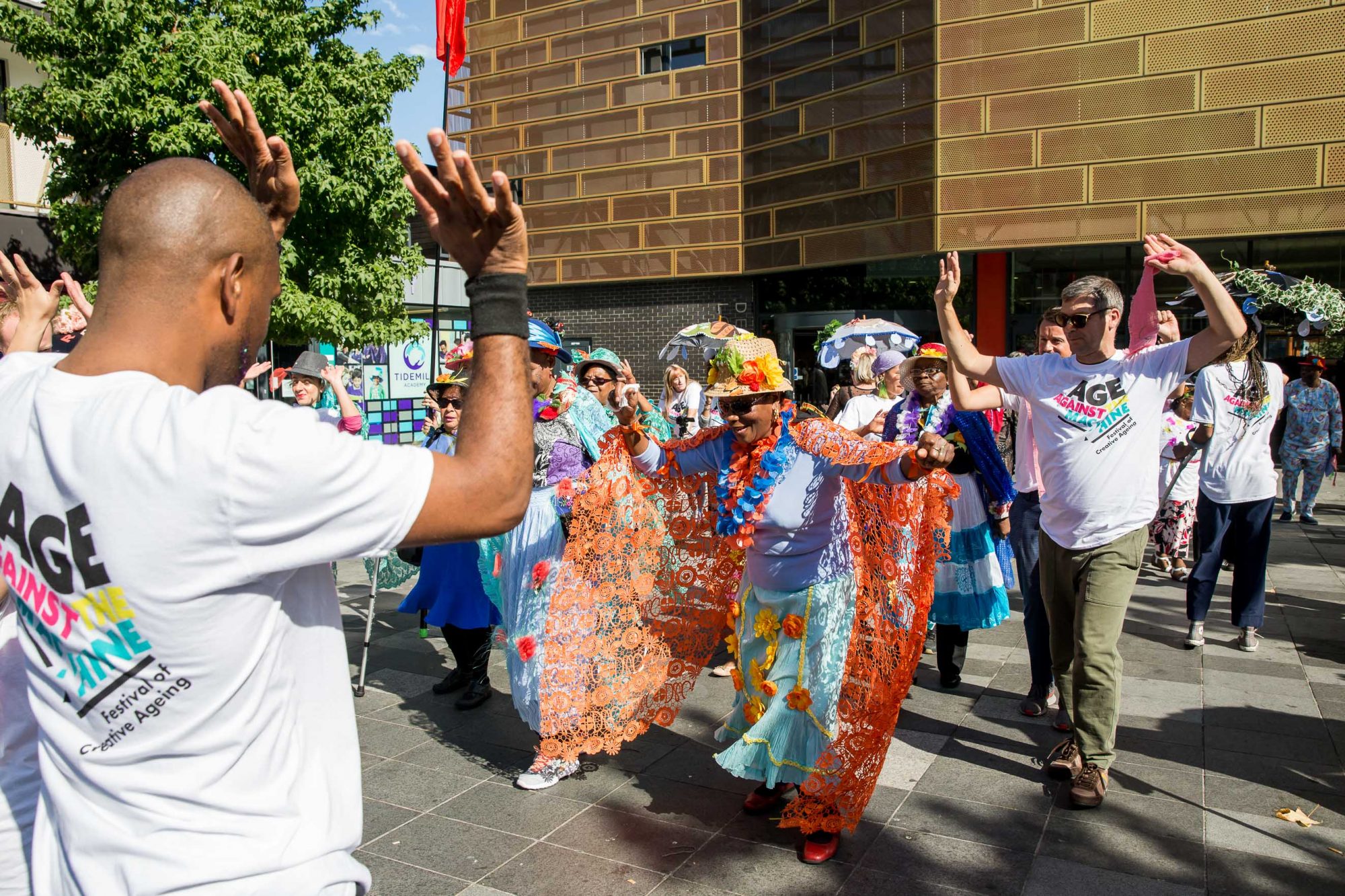 group of people dancing in teh street