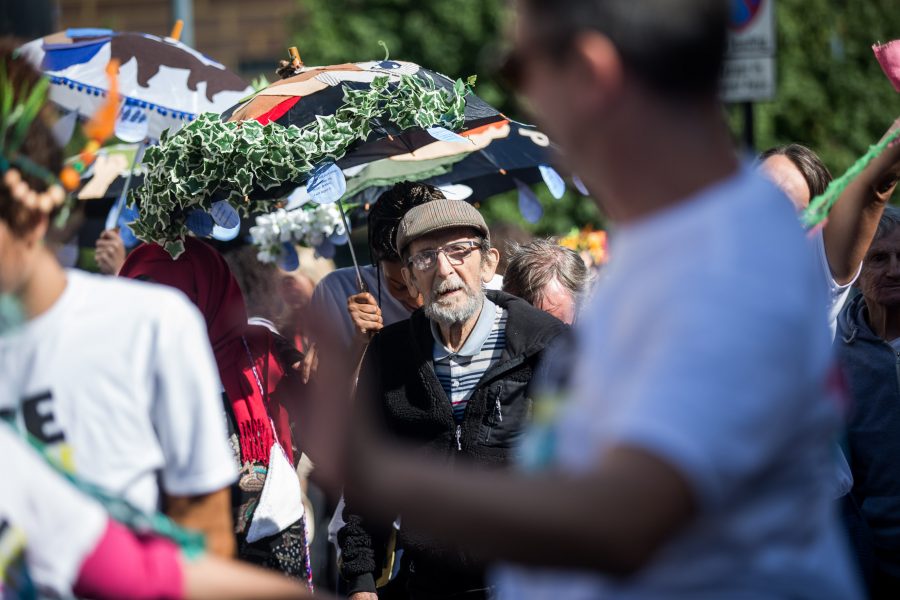 older man outside at a festival