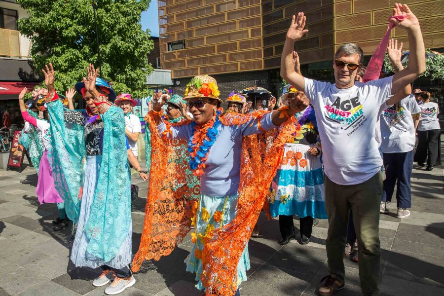 older people dressed up dancing at the festival