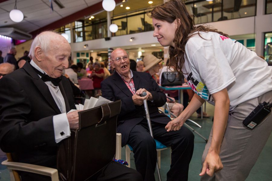 woman helping older men