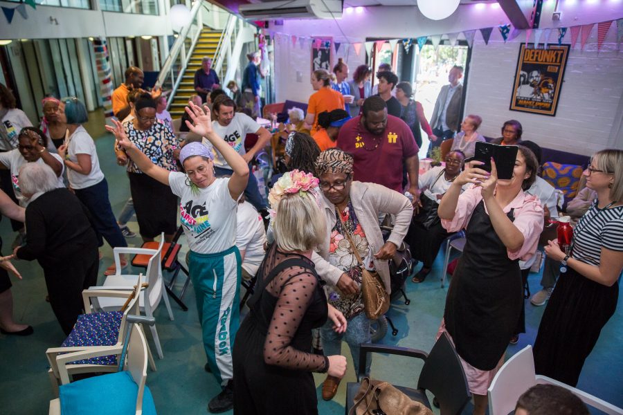 people dancing in a hall