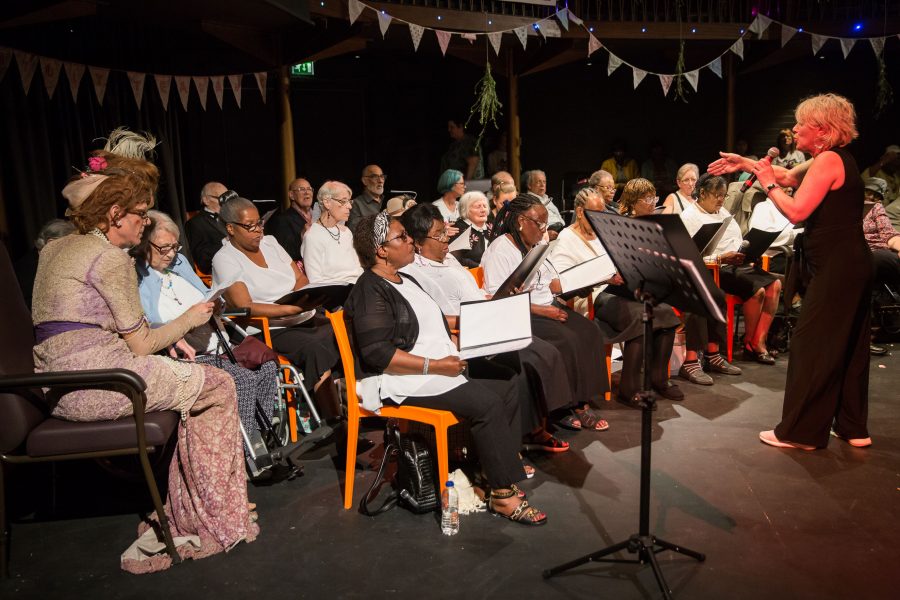 older people sitting down in a choir