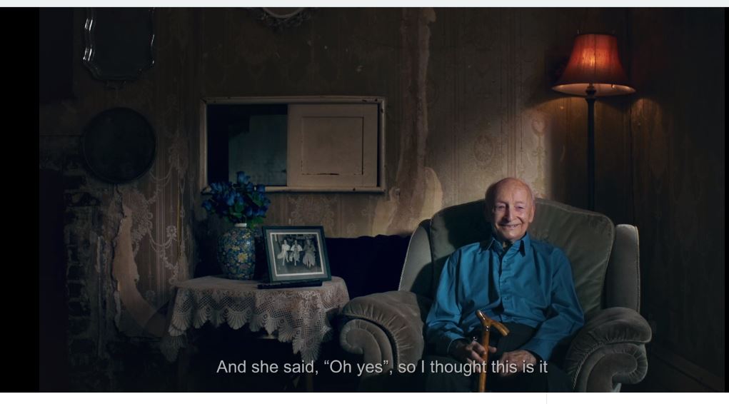 man sitting on sofa