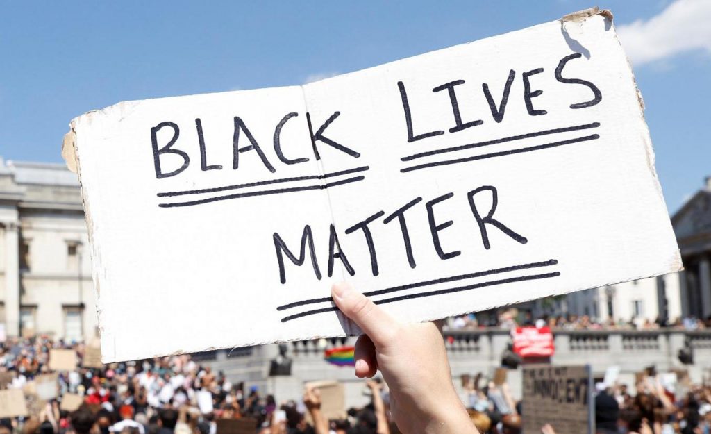 Black Lives Matter handwritten on plackard