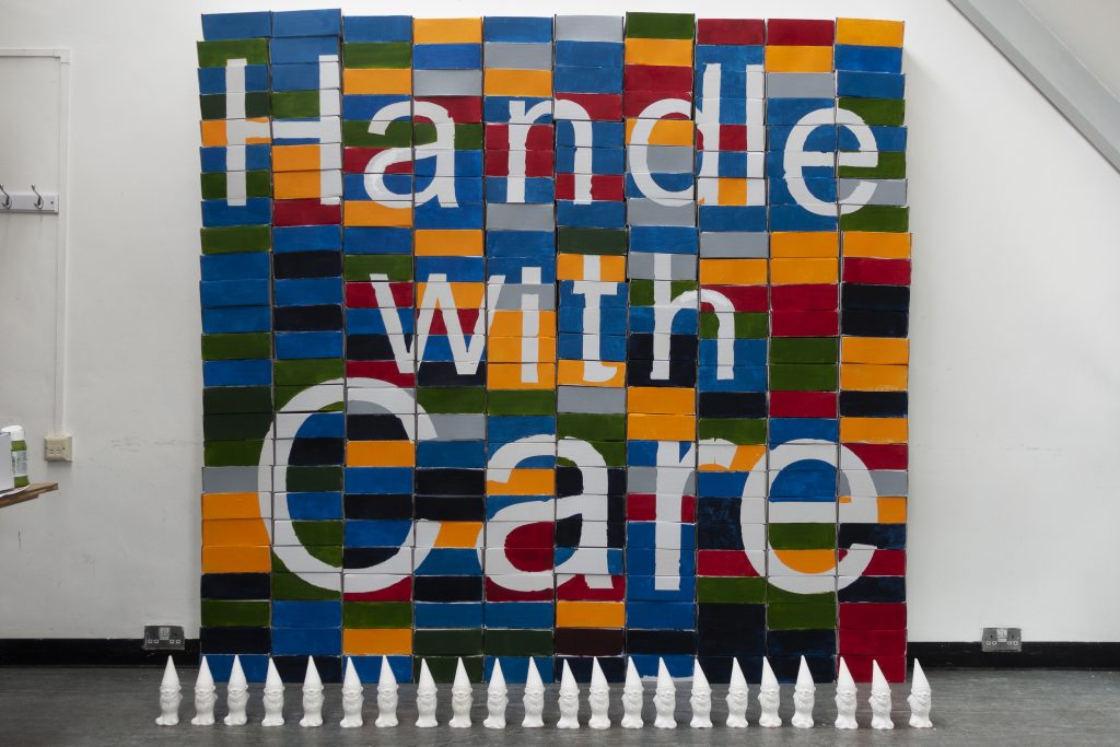 coloured bricks with text saying Handle with Care