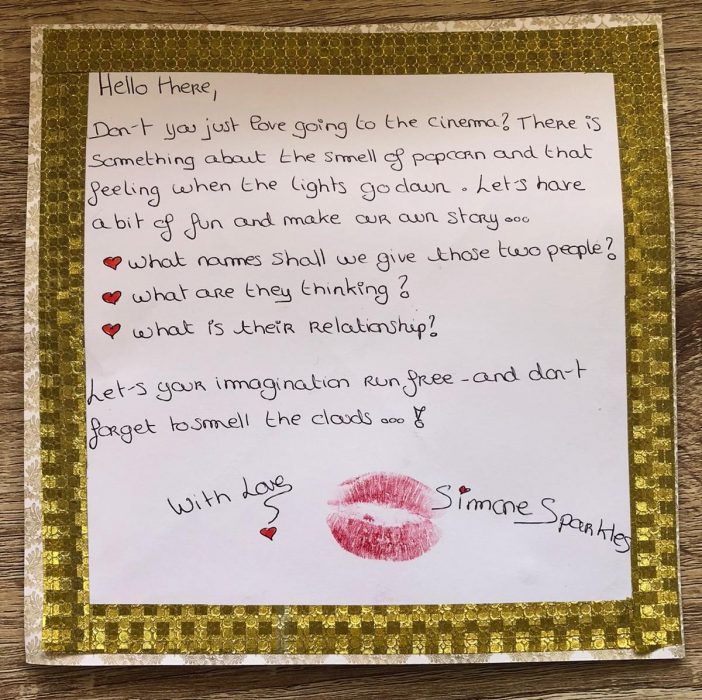 letter with a gold frame and kiss