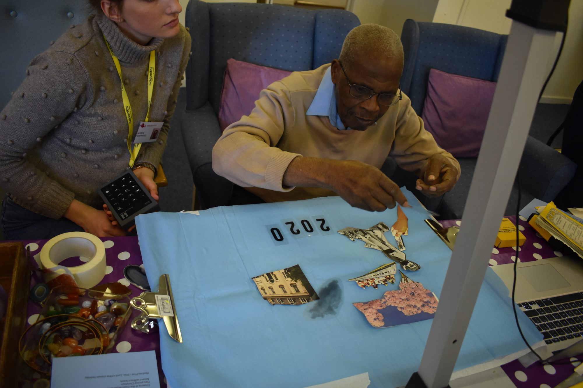 Man doing artwork at a table