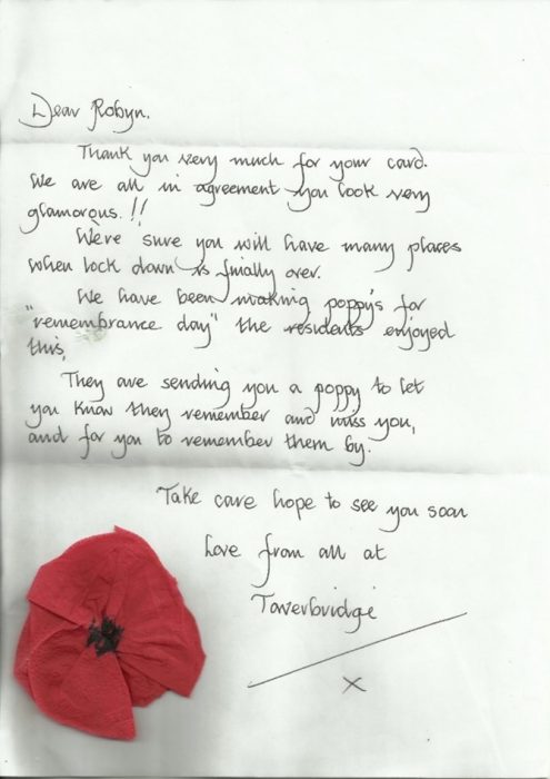 Handwritten Letter with a paper rose on it