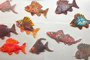 Many painted wooden fish
