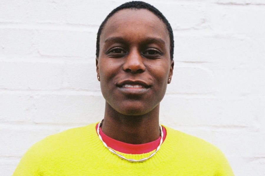 portrait of Remi Graves, a black person wearing a yellow top